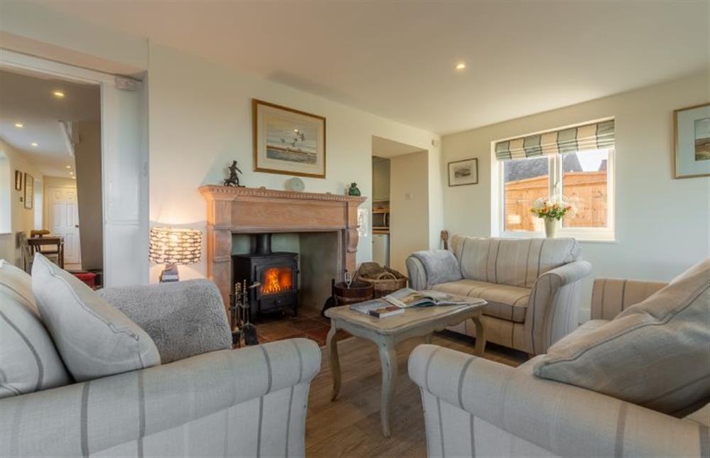 comfortable seating and wood burning stove at Sandpipers, Brancaster Staithe near Kings Lynn