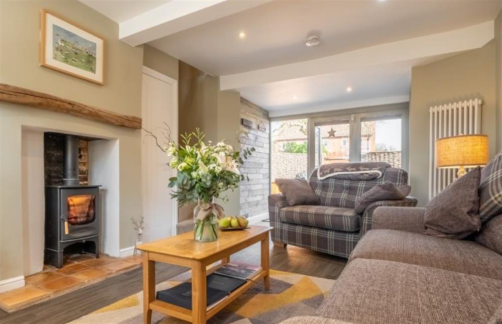 Sandpiperfts Cottage: Sitting room featuring a log burning stove at Sandpipers Cottage, South Creake near Fakenham