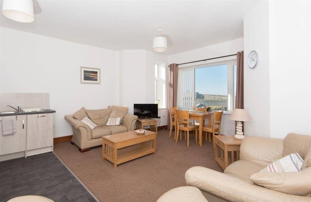 Relax in the living area at Sands at Ocean House in Caernarfon, Gwynedd