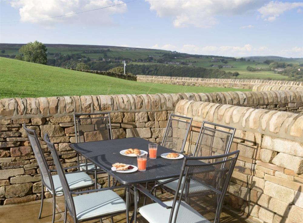Outdoor dining area at Sands Farm Cottage in Luddendenfoot, near Hebden Bridge, West Yorkshire