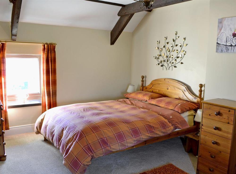 Comfy double bedroom full of character at Sandsedge Cottage in Morpeth, Northumberland
