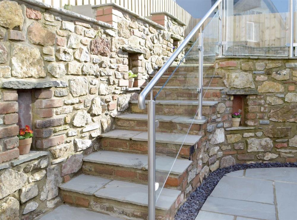 Steps to upper garden area at Sandunes in Tenby, Dyfed