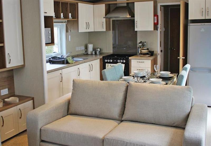 The living room and kitchen at the Superior Caravan 4 at Sandy Balls Holiday Village in Godshill, Fordingbridge