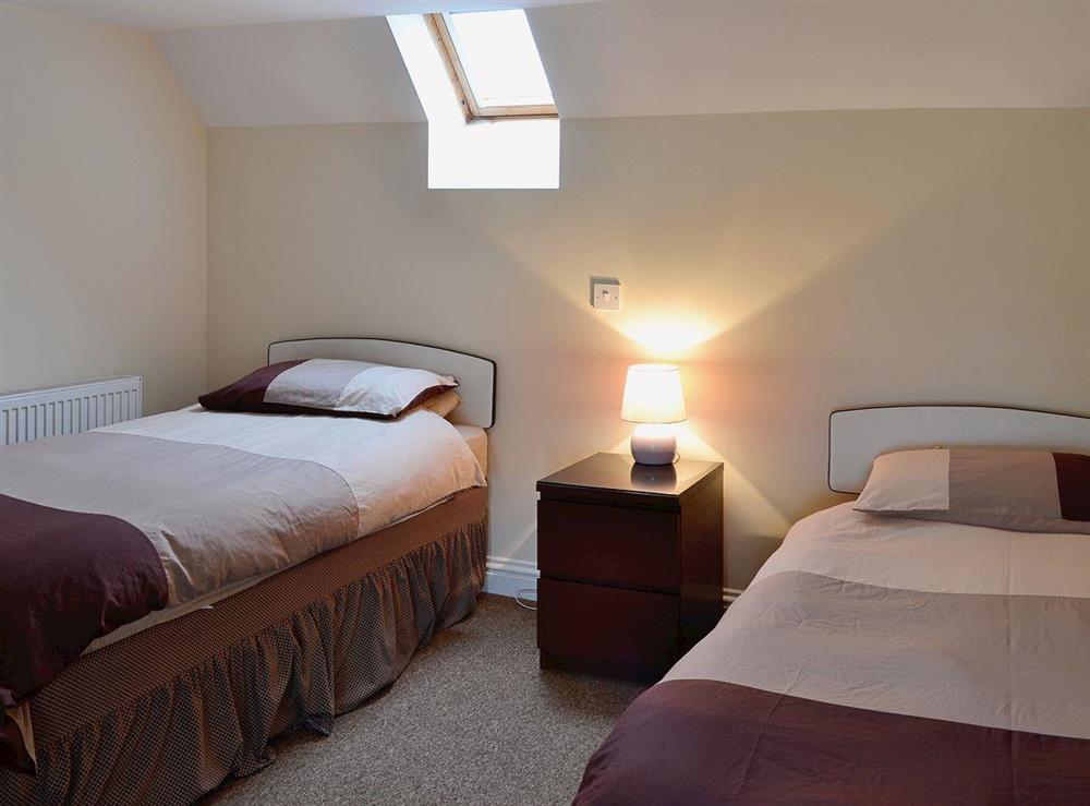 Spacious twin room with sloping ceilings at Sandy Brae Cottage in Findochty, Banffshire