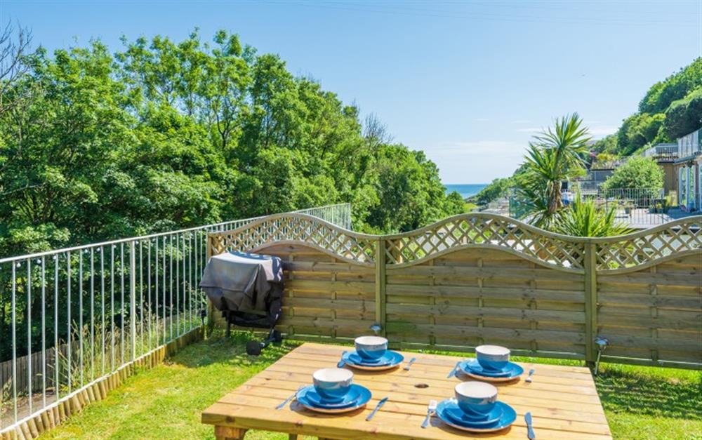 Garden terrace & outdoor seating at Sandy Feet Retreat in Looe