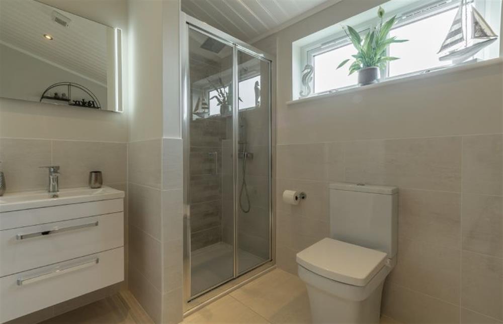 Ground floor: Bathroom with bath and shower cubicle at Sandy Toes, Burnham Market near Kings Lynn
