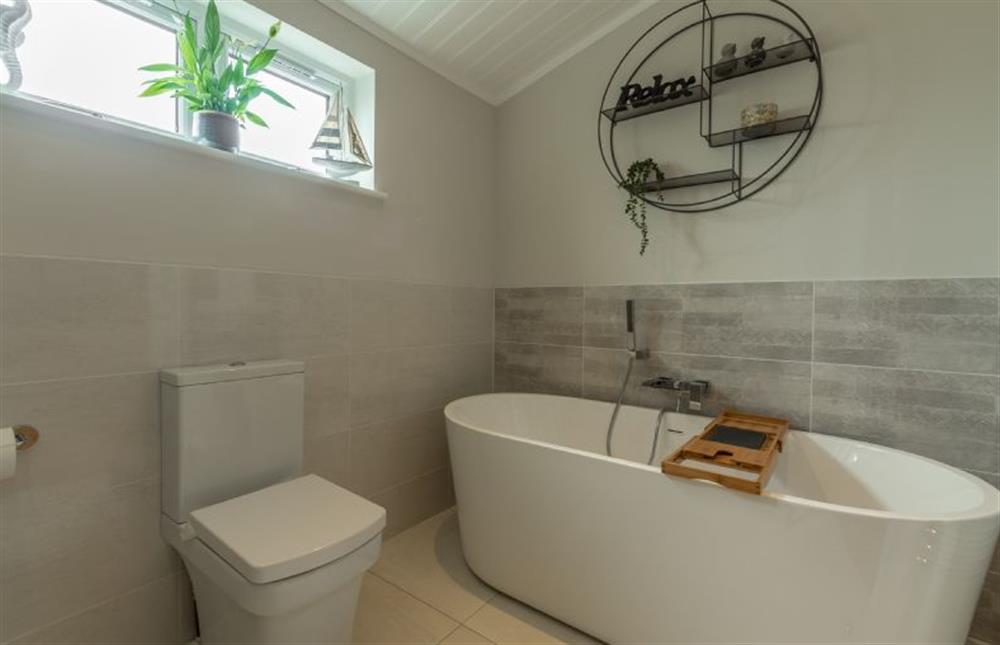 Ground floor: Bathroom with freestanding oval bath at Sandy Toes, Burnham Market near Kings Lynn