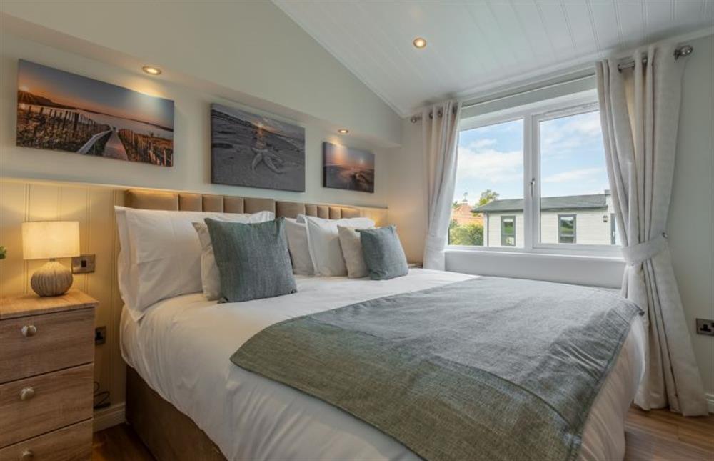 Ground floor: Bedroom three with coastal scenes at Sandy Toes, Burnham Market near Kings Lynn