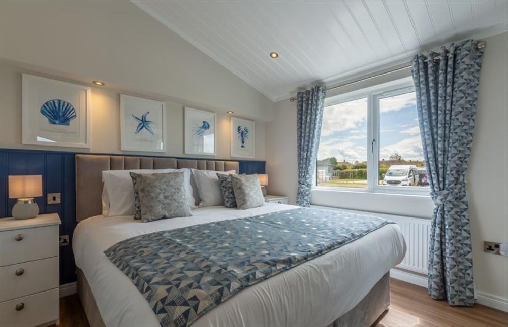 Ground floor: Bedroom two with a coastal theme at Sandy Toes, Burnham Market near Kings Lynn