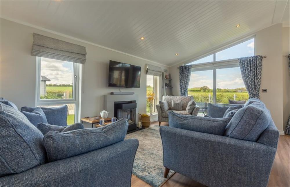 Ground floor: Sitting area with lovely rural views at Sandy Toes, Burnham Market near Kings Lynn