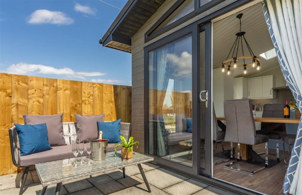 Ground floor: Take a sunny seat on the deck..... at Sandy Toes, Burnham Market near Kings Lynn
