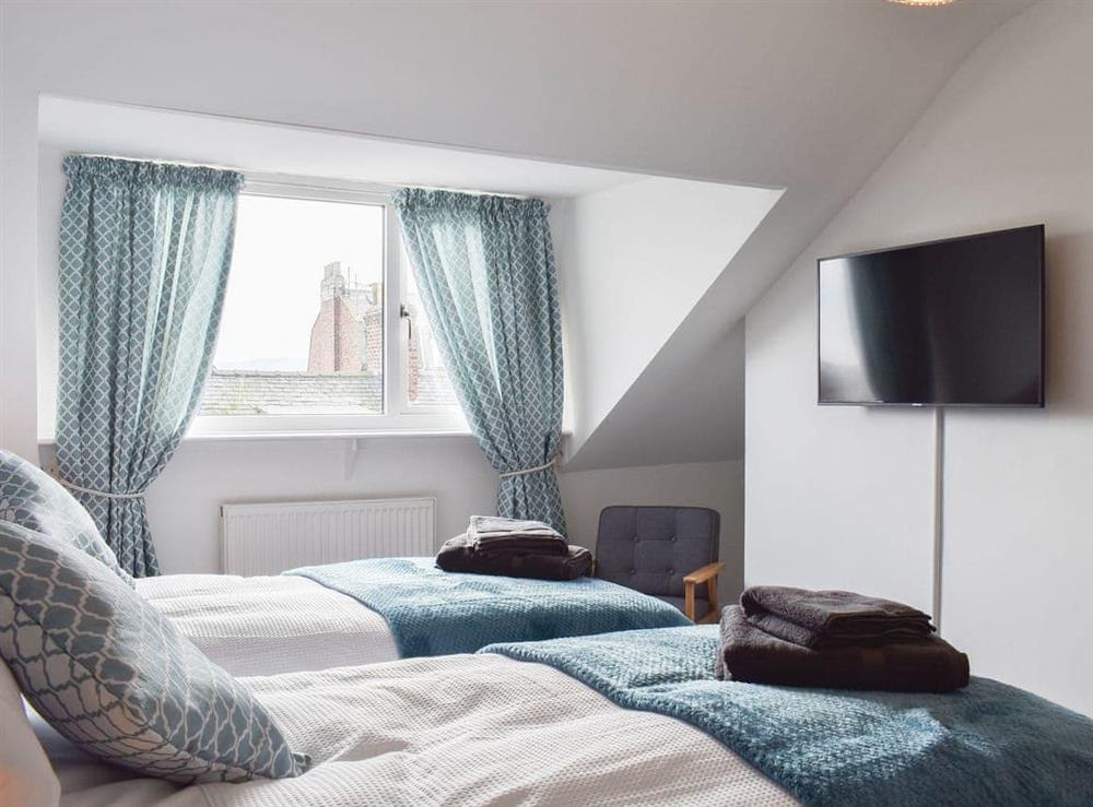 Pretty bedroom with extensive views over the rooftops at Sandy Toes in Whitby, North Yorkshire