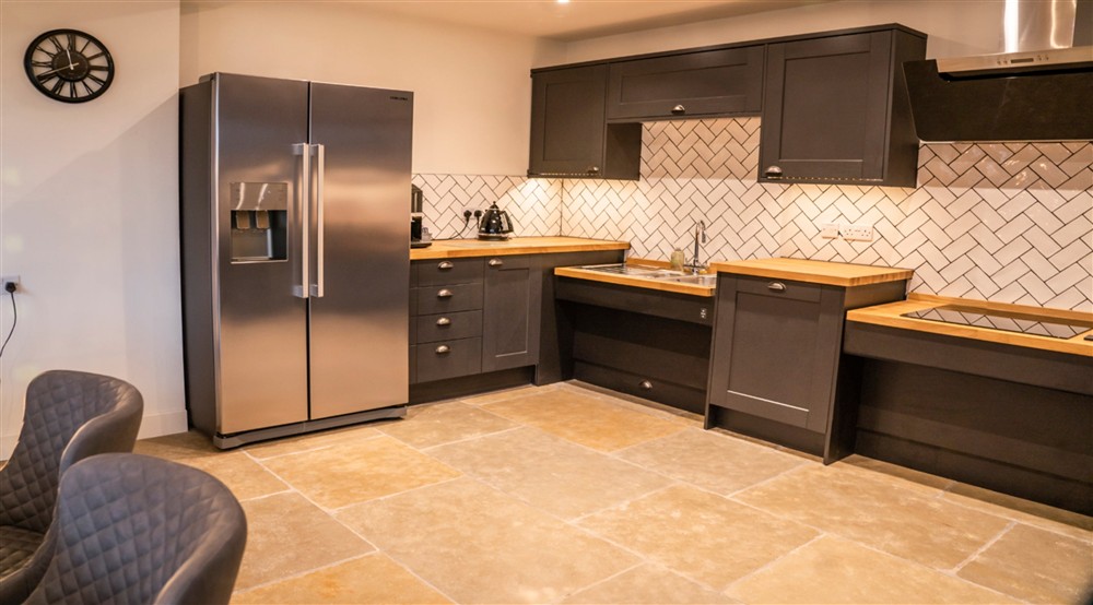 The kitchen - with the adjustable sink and hob in a lowered position - at Sandybury Barn in Bridgnorth, Shropshire