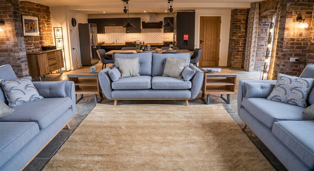 The open-plan kitchen, dining and sitting room at Sandybury Barn in Bridgnorth, Shropshire