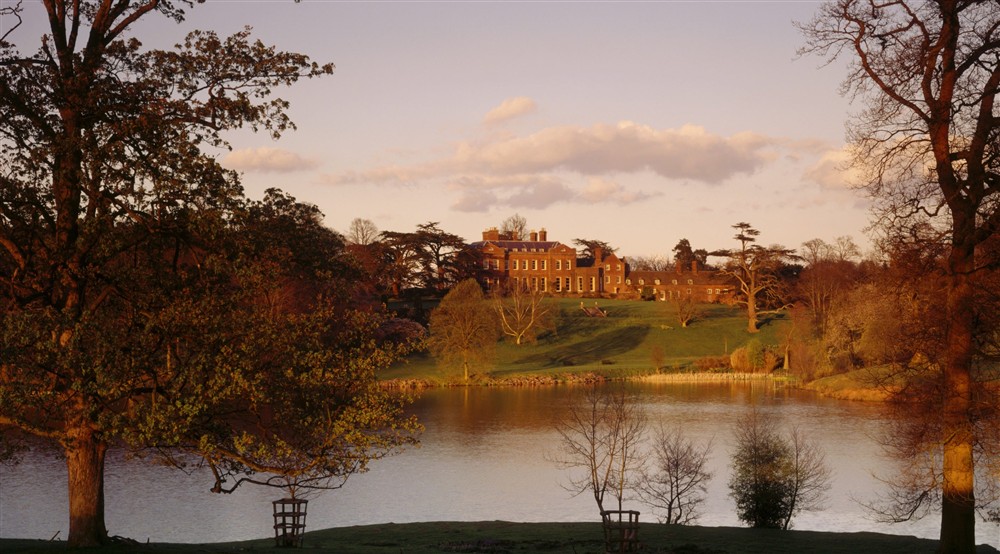 The West Front of Dudmaston in Shropshire from across the Big Pool at Sandybury Barn in Bridgnorth, Shropshire