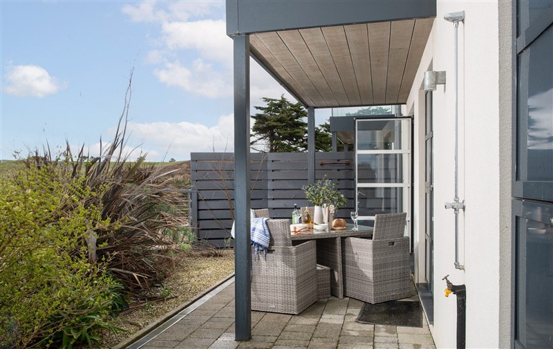 Enjoy a glass of wine on the patio at Sandyford, Cornwall