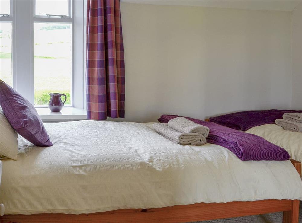Comfy twin bedroom at Sandyhouse Cottage in Milfield, near Wooler, Northumberland