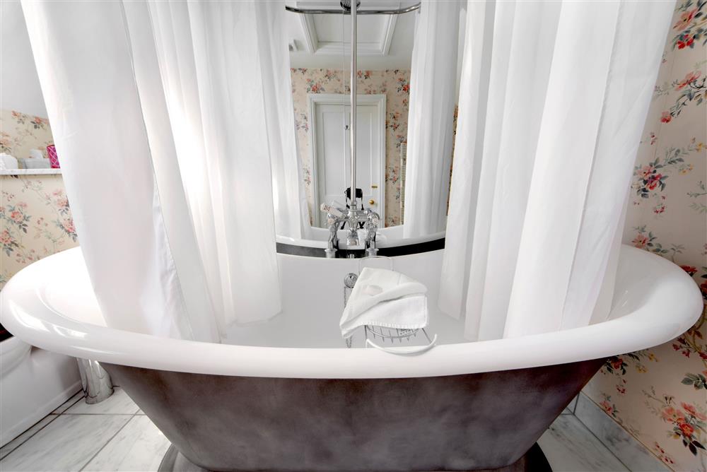 Relax in the beautiful roll-top bath at Saratoga Cottage, Bruern, near Chipping Norton
