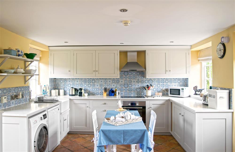 The well-equipped kitchen, with dining table  at Saratoga Cottage, Bruern, near Chipping Norton