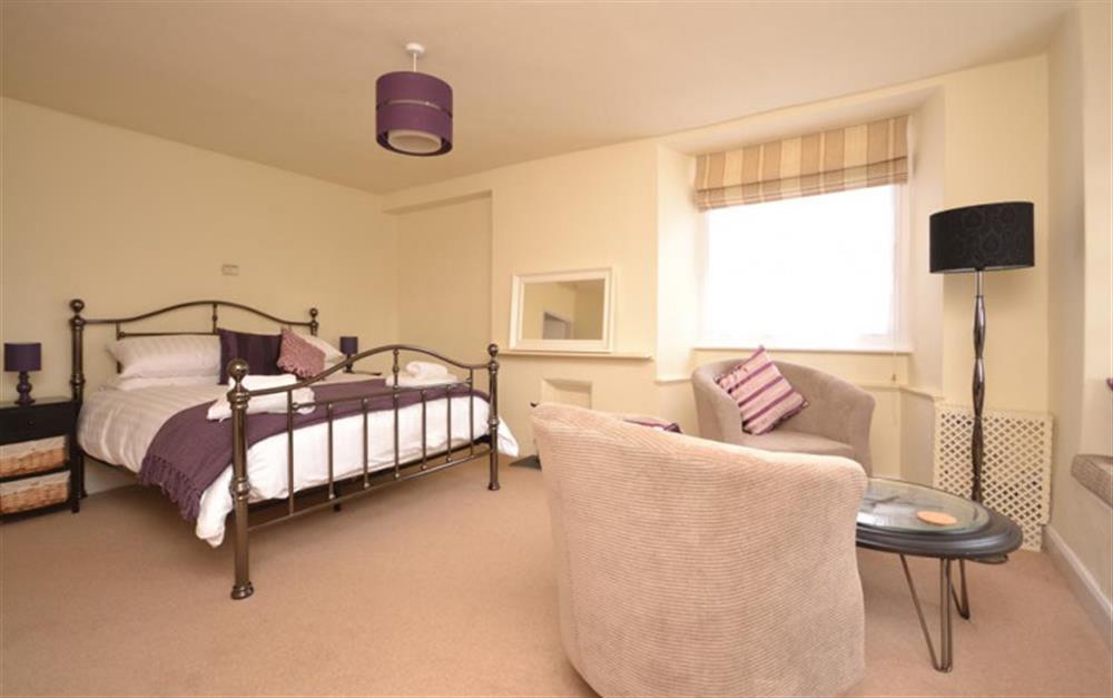 The spacious master bedroom with a seating area. at Sashes in Minehead
