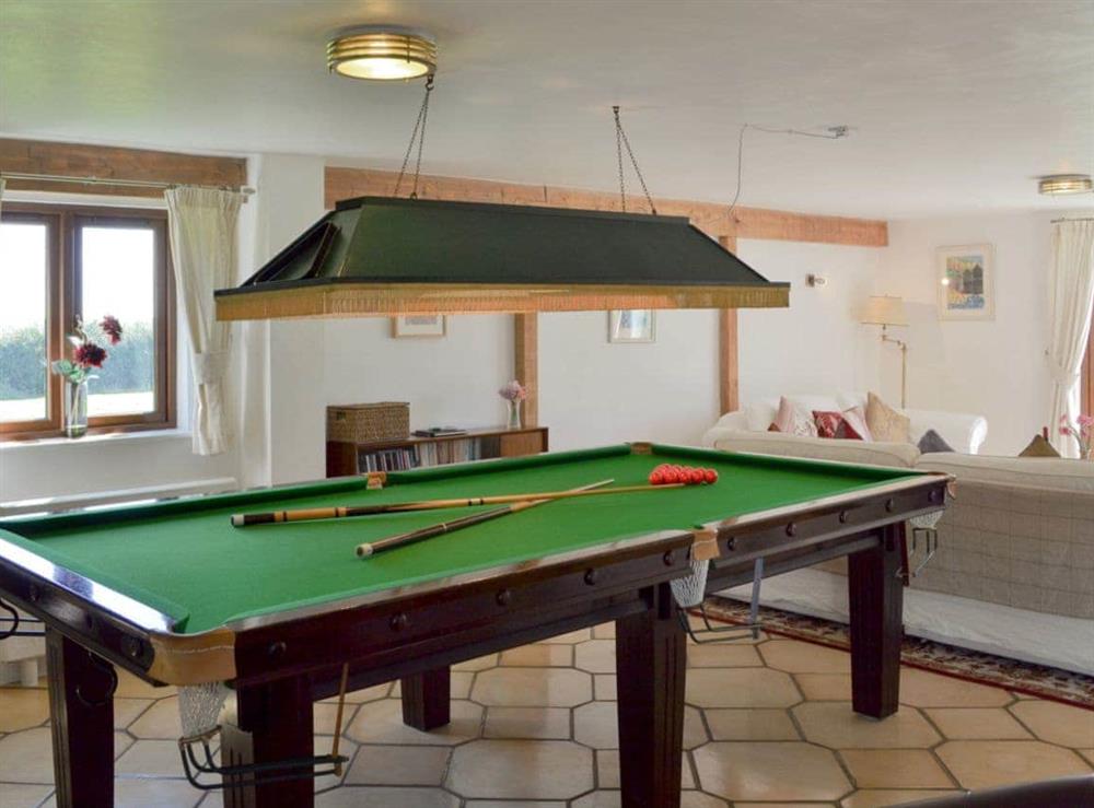 Full size snooker table in the living room at Saunders Oast Barn in Guestling, Nr Hastings, East Sussex., Great Britain