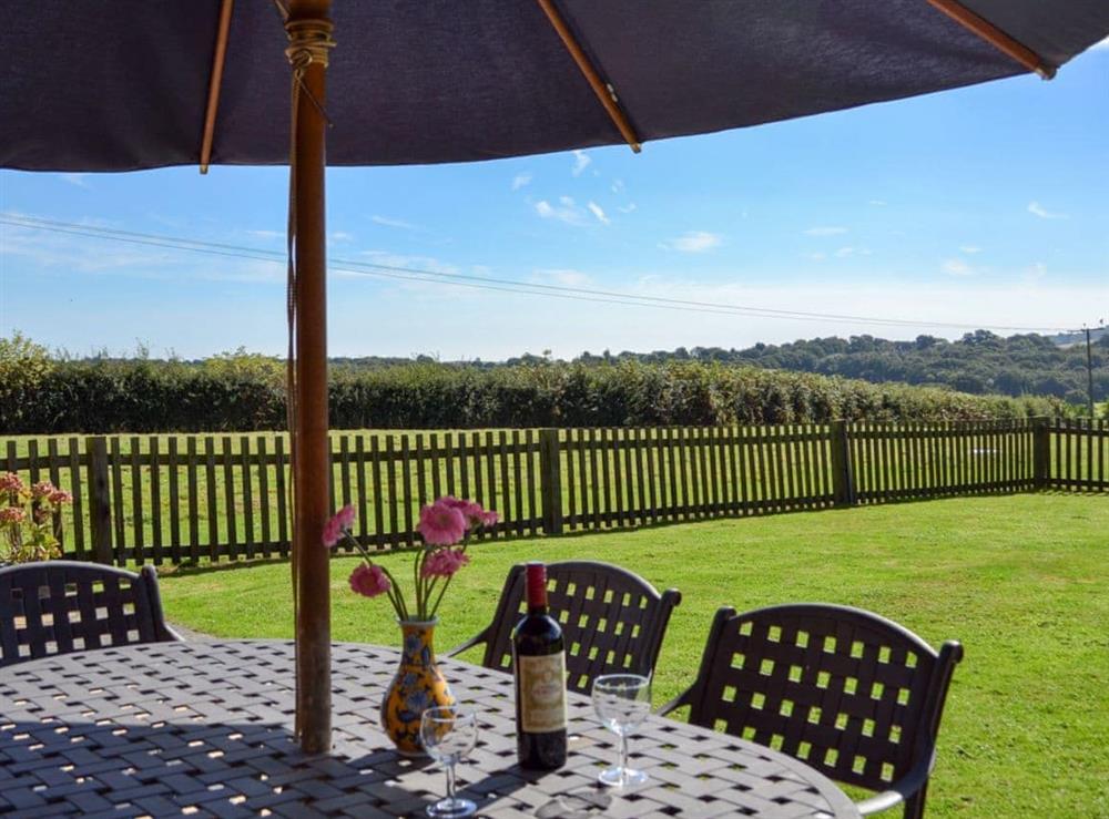 Sitting out area with countryside views at Saunders Oast Barn in Guestling, Nr Hastings, East Sussex., Great Britain