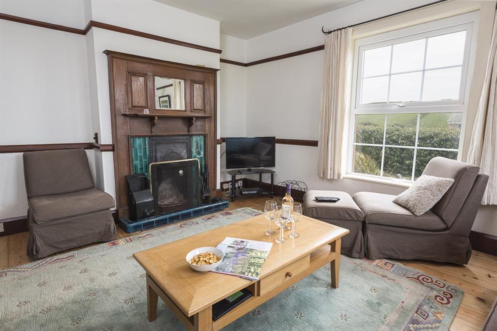 A comfortably furnished room with a working open fire at Savernake in , Thurlestone