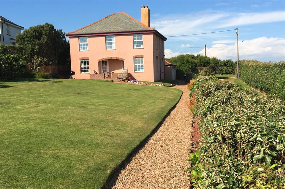 Beautiful mature gardens to the front, side and rear of the house at Savernake in , Thurlestone