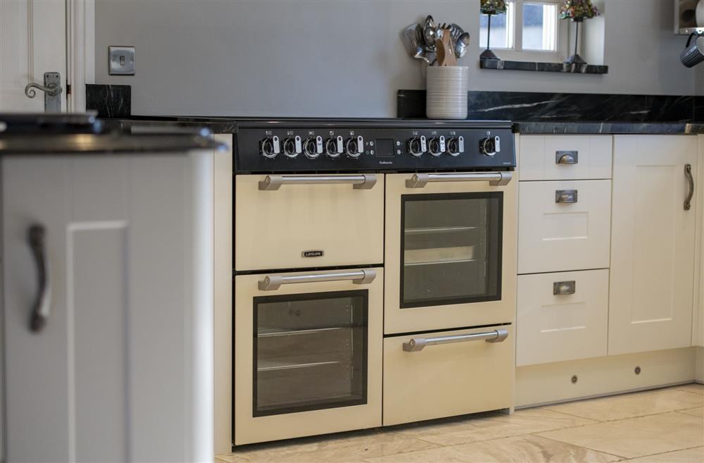 The kitchen boasts a large electric range oven at Saxon House, Harome, Nr Helmsley