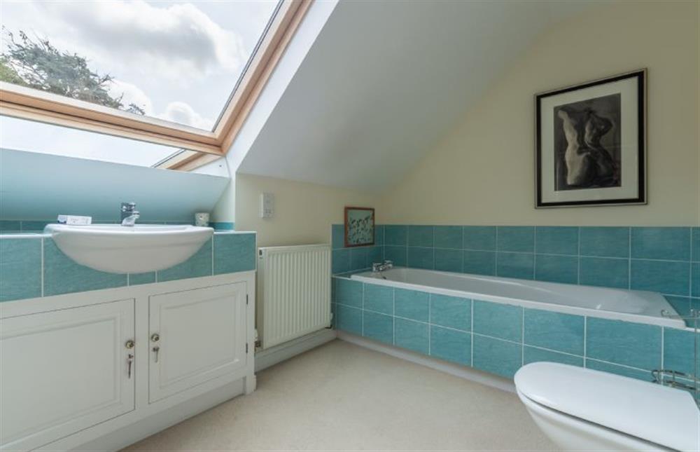 First floor: Master suite bathroom has bath and separate shower at Saxon Shore Cottage, Burnham Deepdale near Kings Lynn