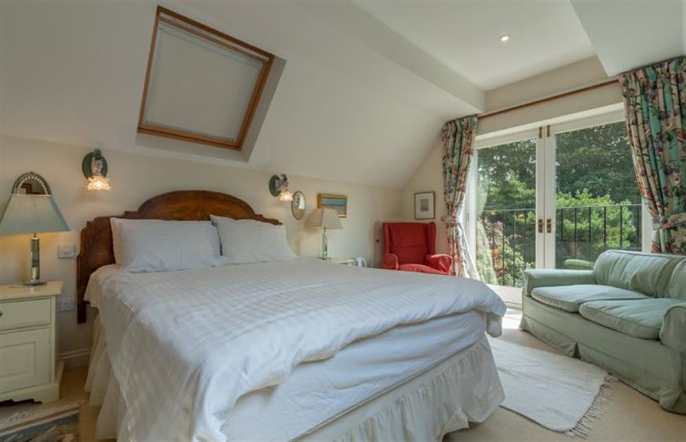 First floor: Master suite has Juliette balcony at Saxon Shore Cottage, Burnham Deepdale near Kings Lynn
