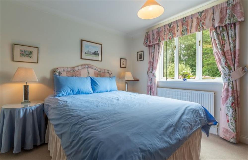 Ground floor: Bedroom two has double bed and en suite shower room at Saxon Shore Cottage, Burnham Deepdale near Kings Lynn