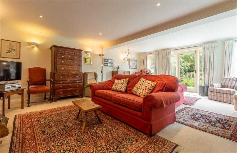 Ground floor:Sitting room has french doors into the garden at Saxon Shore Cottage, Burnham Deepdale near Kings Lynn