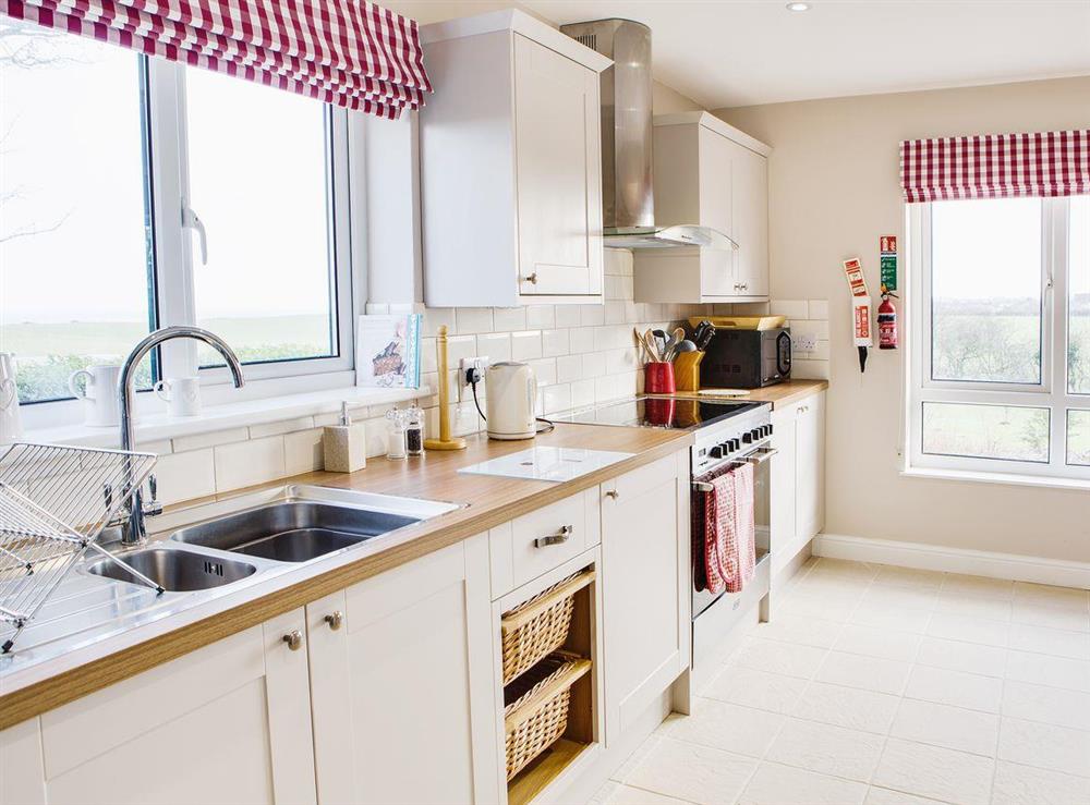 Modern appliances and a tiled floor coupled with the large windows make the kitchen area bright and airy at Scalby Lodge Farmhouse in Scalby, Scarborough, N. Yorks., North Yorkshire