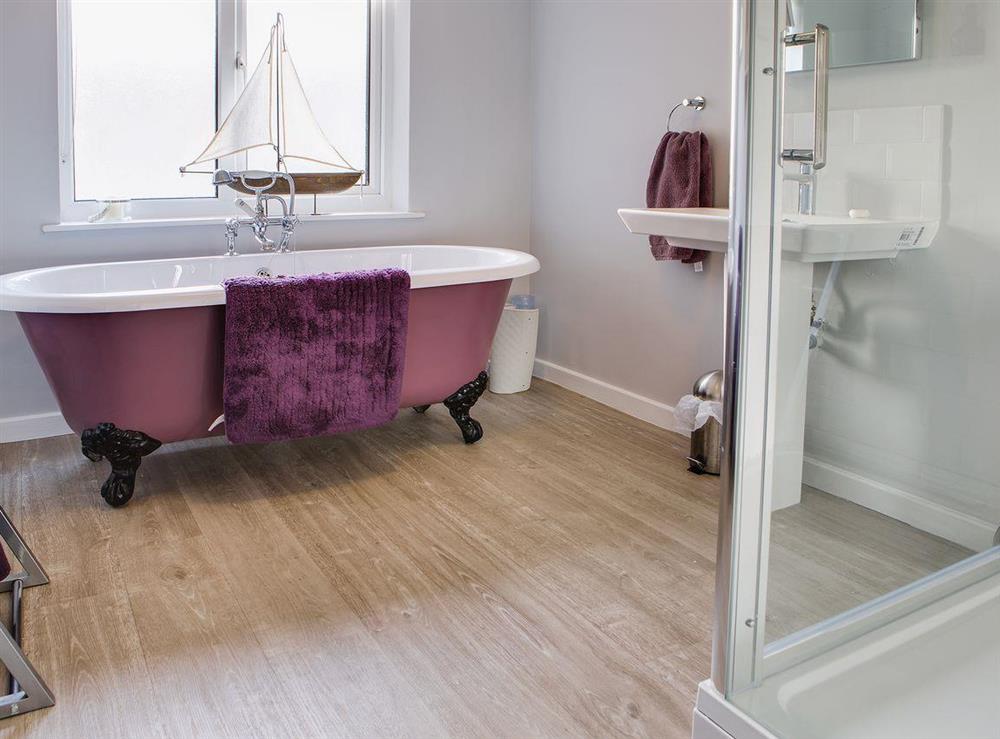The ground floor bathroom has a roll-top bath and separate shower cubicle at Scalby Lodge Farmhouse in Scalby, Scarborough, N. Yorks., North Yorkshire