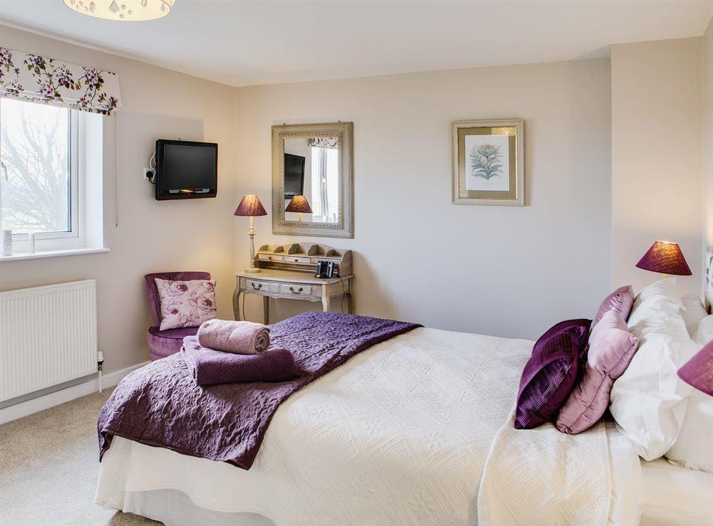 The master bedroom has a large window so you can appreciate the views at Scalby Lodge Farmhouse in Scalby, Scarborough, N. Yorks., North Yorkshire