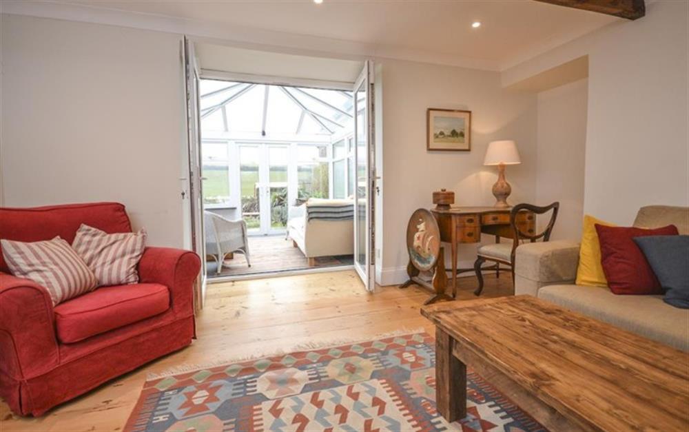 Another look at the lounge which has an adjoining conservatory at School Cottage in Hope Cove