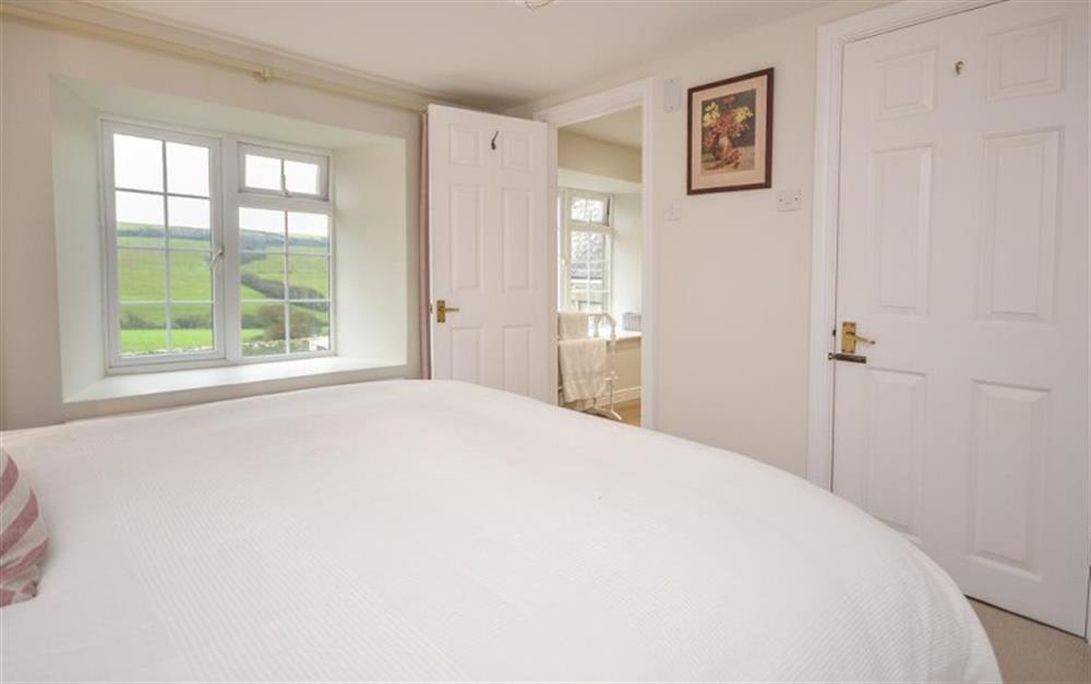 Another view of bedroom 1 which has an en suite bathroom at School Cottage in Hope Cove