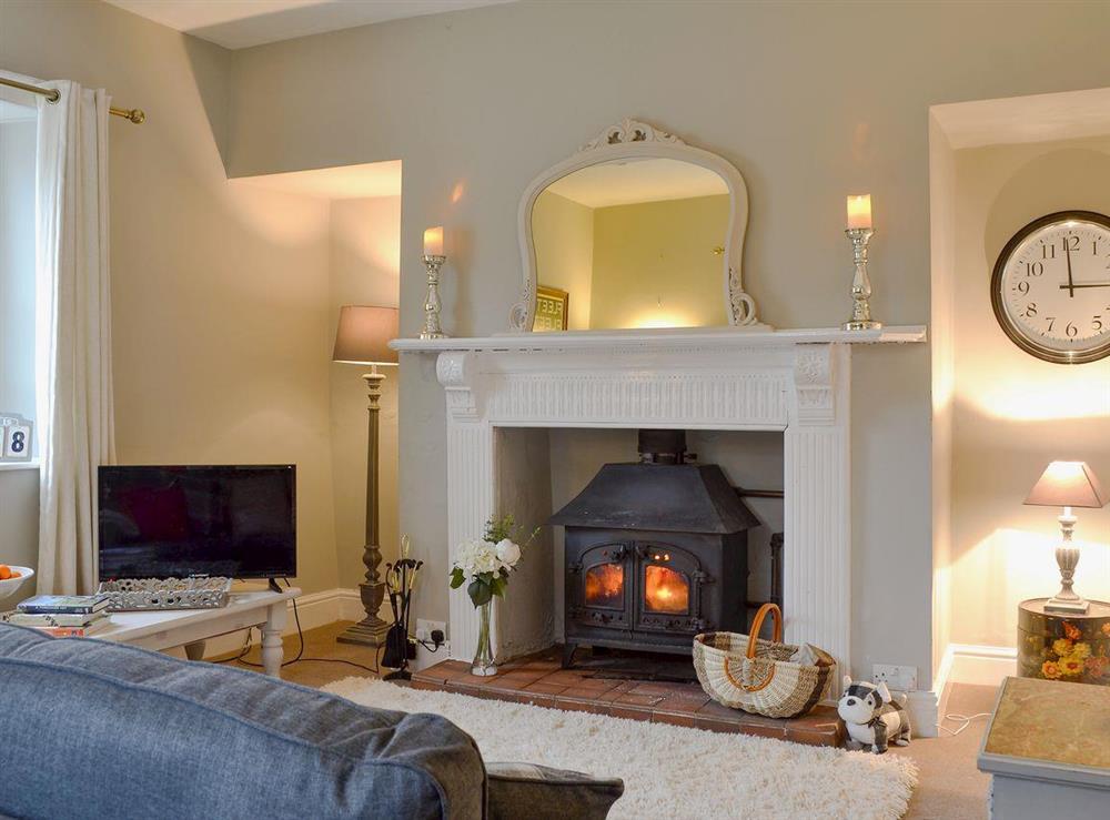 Delightful living room with a cosy wood burner at School House Cottage in Coxwold, near Thirsk, North Yorkshire