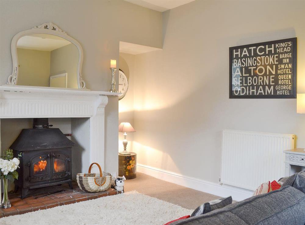 Warm and cosy living room with wood burner at School House Cottage in Coxwold, near Thirsk, North Yorkshire