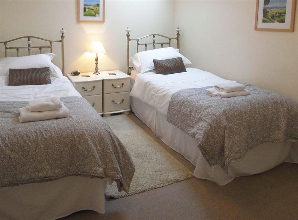 Comfortable twin bedroom at School Knott Cottage in Windermere, Cumbria