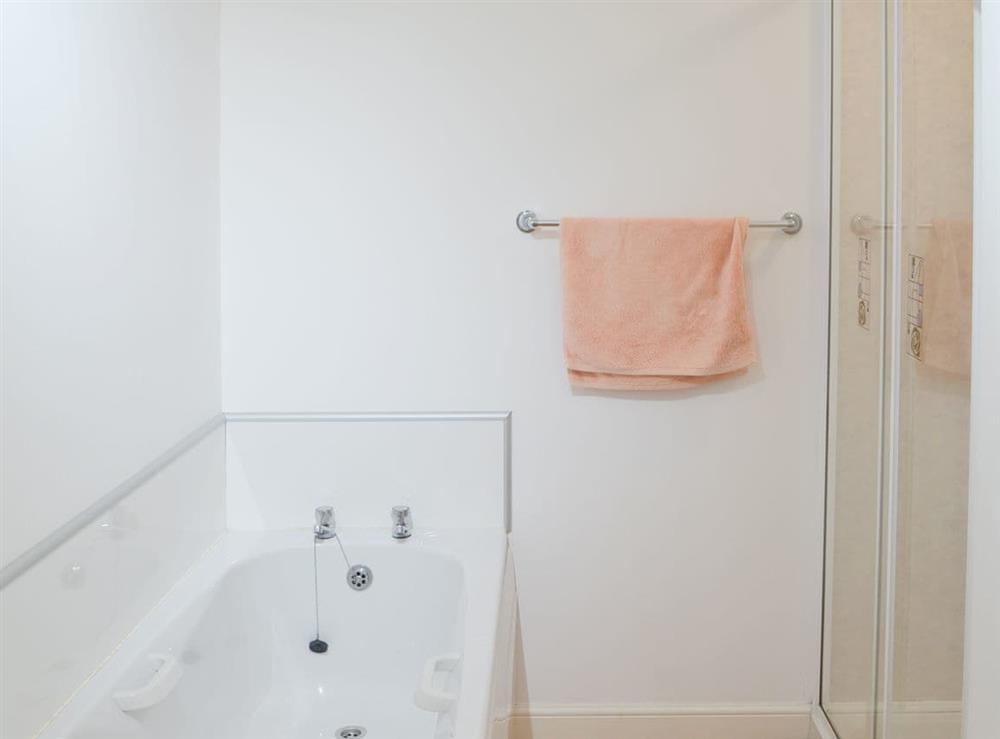 Bathroom with bath and shower cubicle at White Gables, 