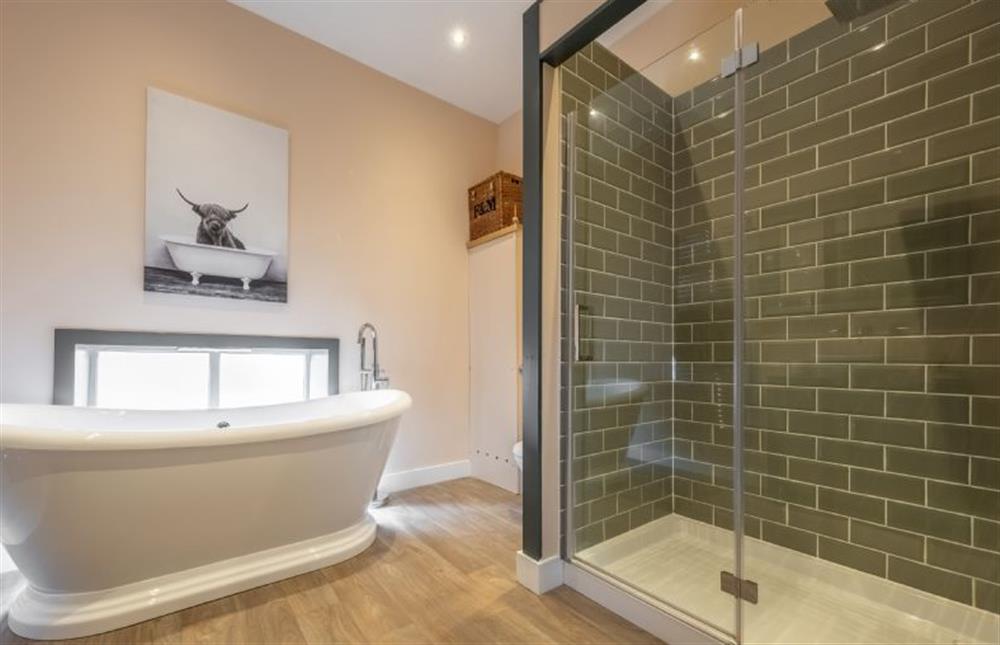 En-suite with roll top bath and rainfall shower at Scouts Cottage, Snettisham near Kings Lynn