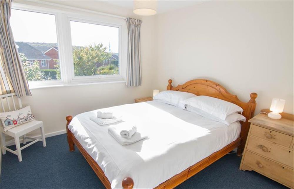 First floor: Bedroom three has a king-size bed at Sea Aster, Brancaster Staithe near Kings Lynn