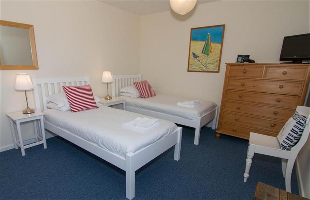 First floor: Bedroom three has twin beds at Sea Aster, Brancaster Staithe near Kings Lynn