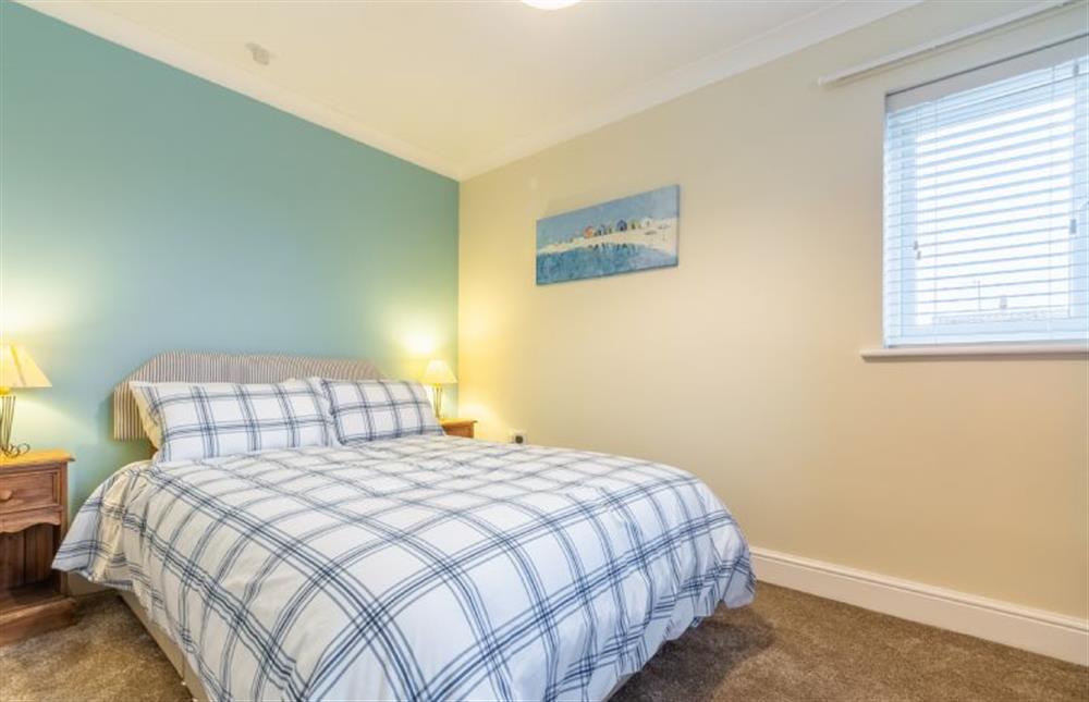 Ground floor: Master bedroom with double bed  at Sea Breeze, Brancaster near Kings Lynn