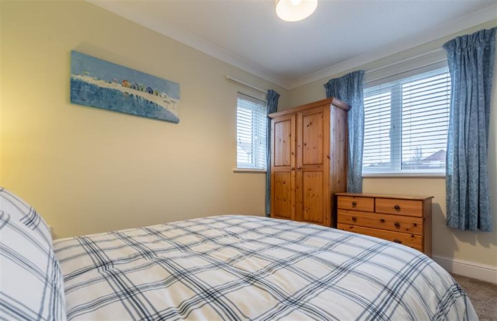 Ground floor: Master bedroom with double bed, wardrobe and drawers  at Sea Breeze, Brancaster near Kings Lynn