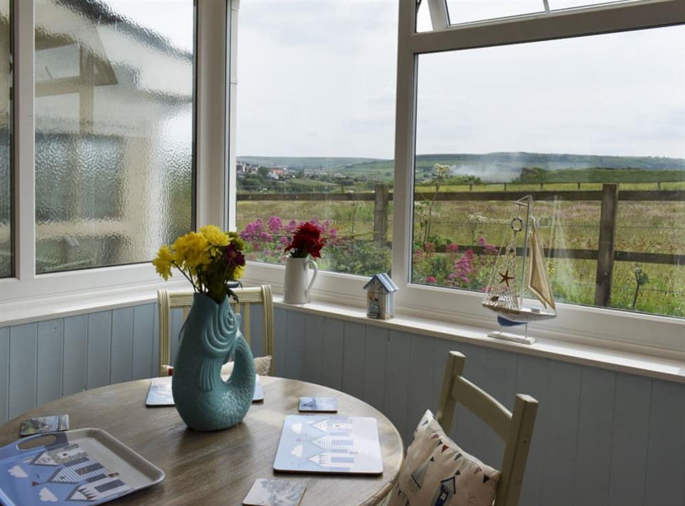 Conservatory and dining room (photo 2) at Sea Breeze Cottage in Cowbar, near Staithes, North Yorkshire