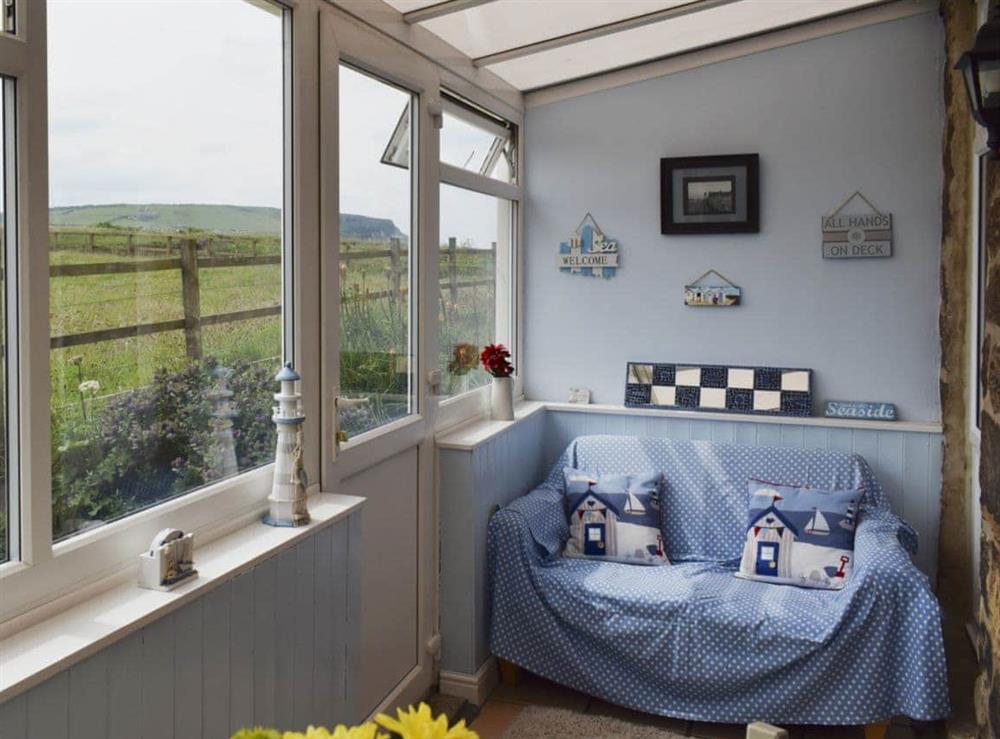 Conservatory and dining room at Sea Breeze Cottage in Cowbar, near Staithes, North Yorkshire