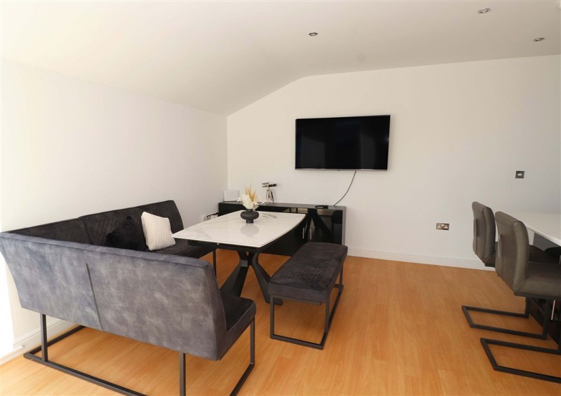 Relax in the living area at Sea Breeze Retreat, Pwllheli